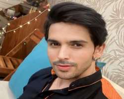 Dhami has piercing in both of his ears.